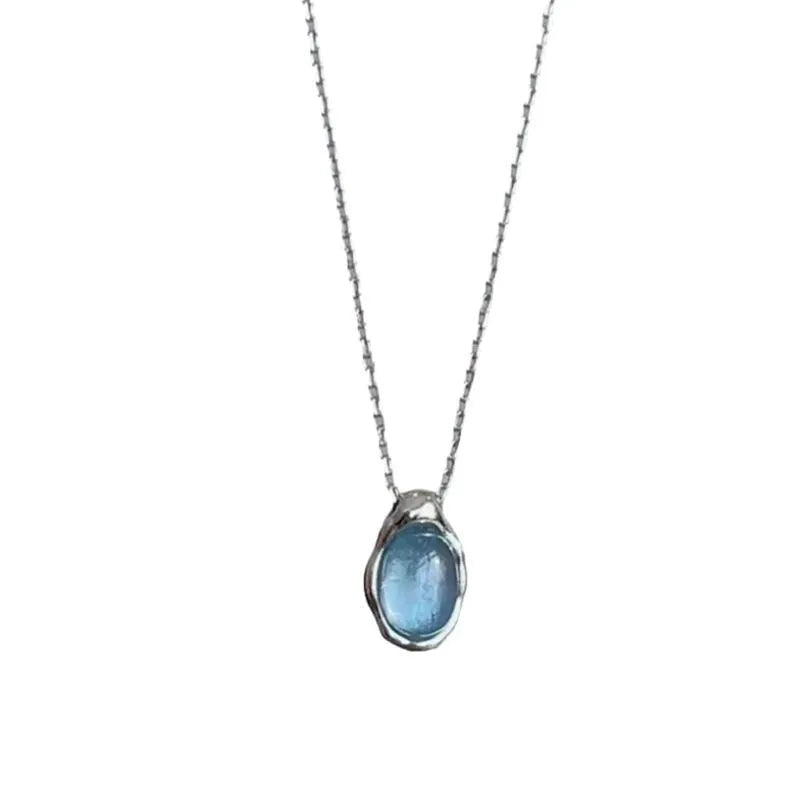 Navy blue water drop pendant necklace with adjustable cross chain in platinum colour