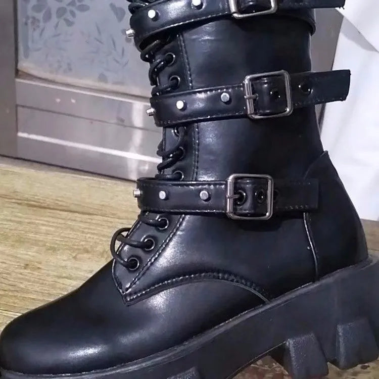 Black women's mid-calf boots with a large metal buckle and side zipper, featuring a round toe.