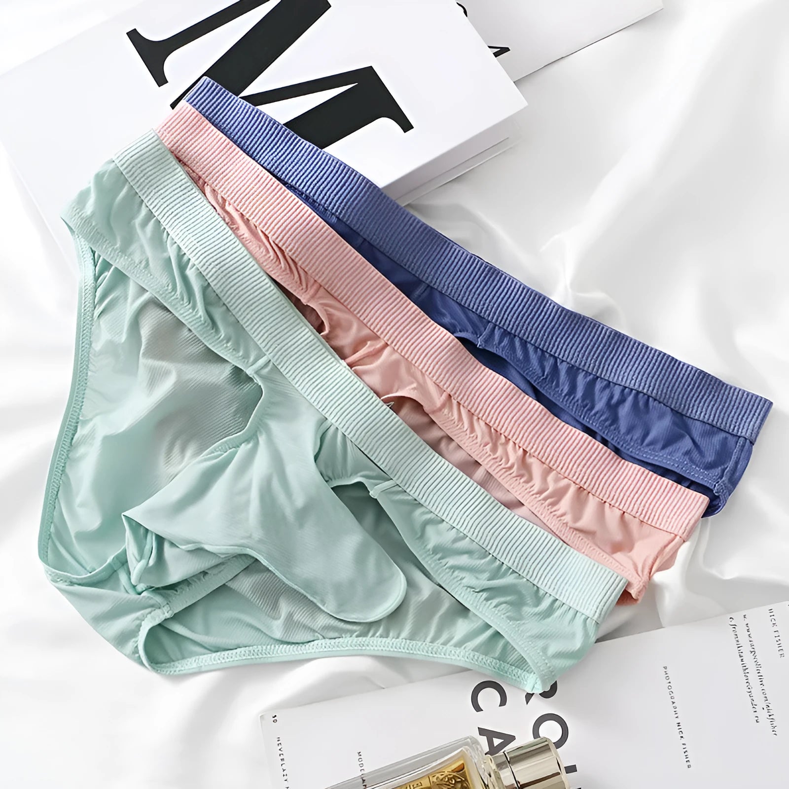 Men's low waist briefs underwear in ice silk fabric showing multiple colour options