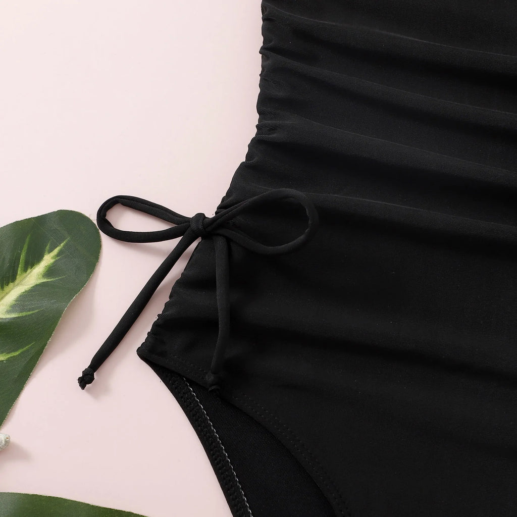 Children's solid black pleated tie swimsuit briefs in polyester spandex for swimming and wading