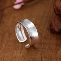 Geometric open ring with frosted sterling silver finish and adjustable opening
