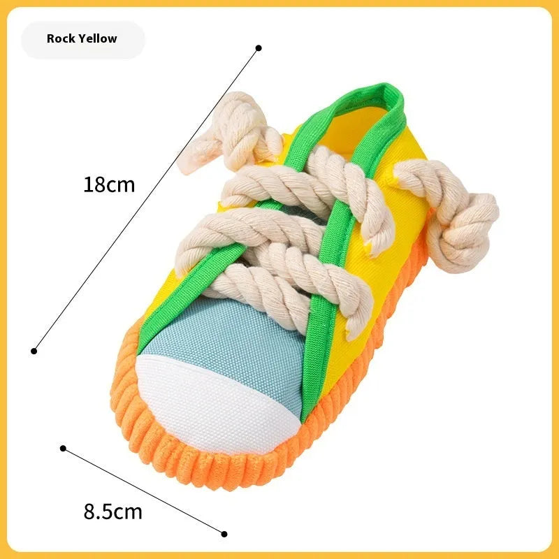 Slipper-shaped plastic dog chew toy with squeaker in yellow, black, or blue colour options