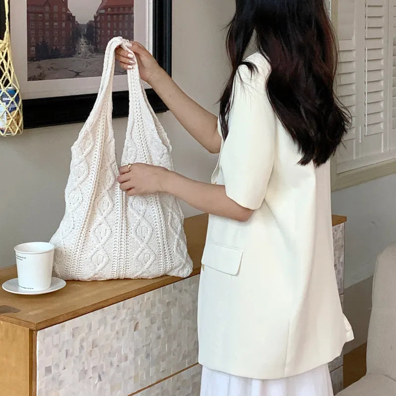 Large retro hollow knitted woolen tote bag with double shoulder straps in a solid colour.