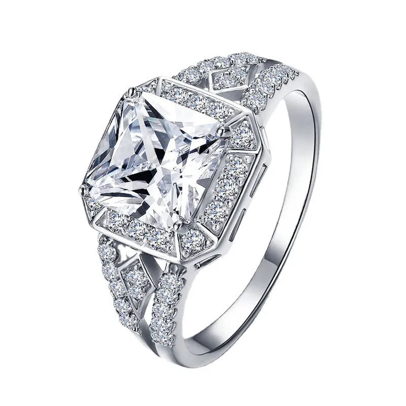 Geometric hollow design zircon ring in platinum-colour finish on copper, showing quadrilateral stone faceting