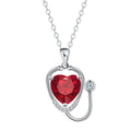 Red diamond women's necklace with a stethoscope, wings, and cross pendant on an adjustable chain.
