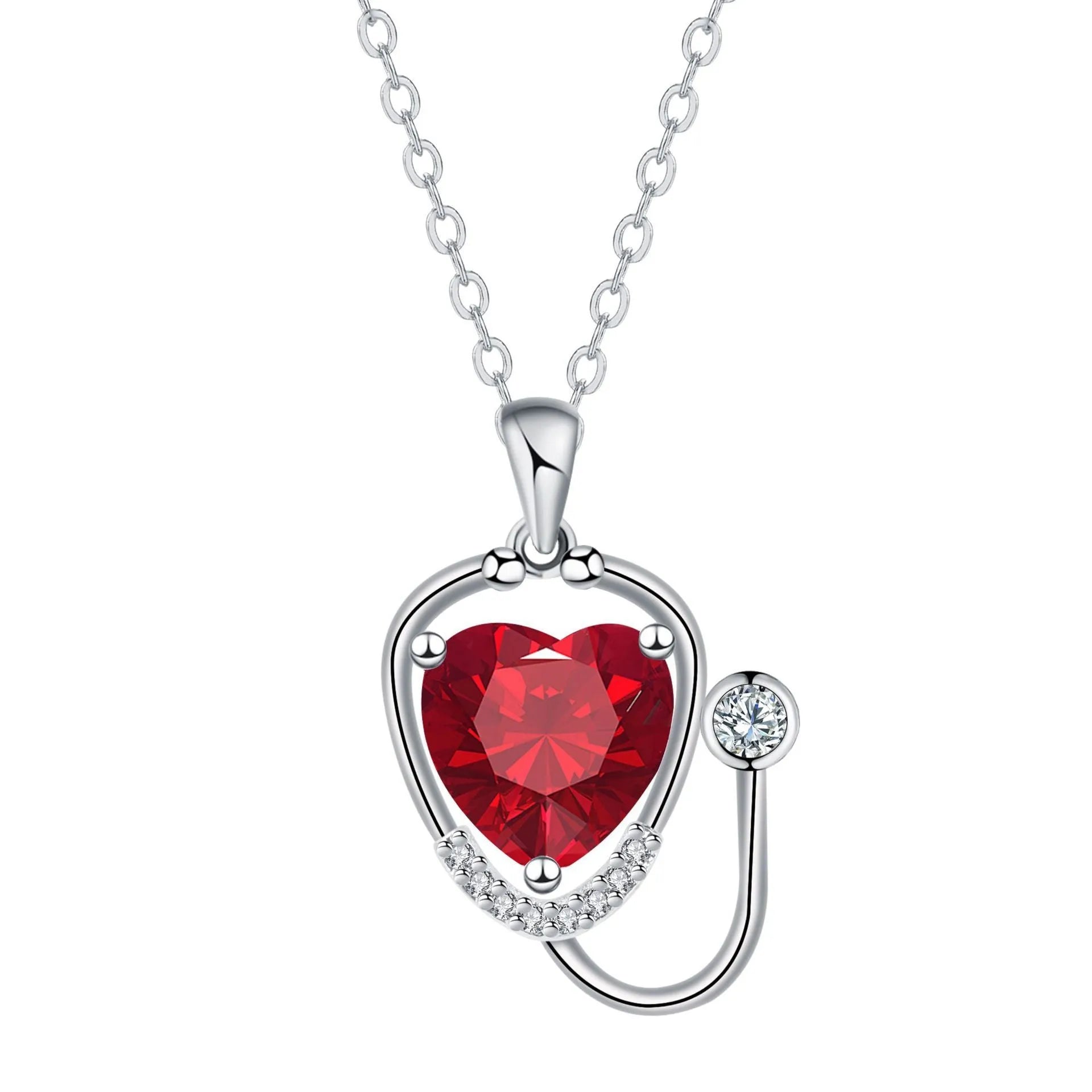 Red diamond women's necklace with a stethoscope, wings, and cross pendant on an adjustable chain.