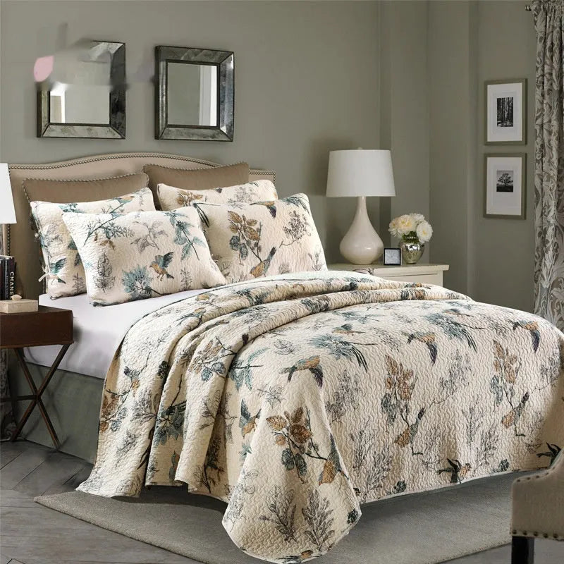 Quilted pure cotton bed cover set with printed pattern on a bed