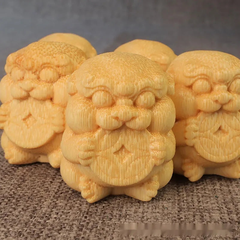 Solid bamboo carving ornament with traditional Take Money design measuring 4.5cm tall