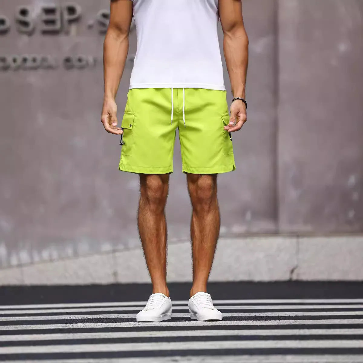 Men's loose fit workwear shorts in army green and fluorescent green colours with straight leg street style design