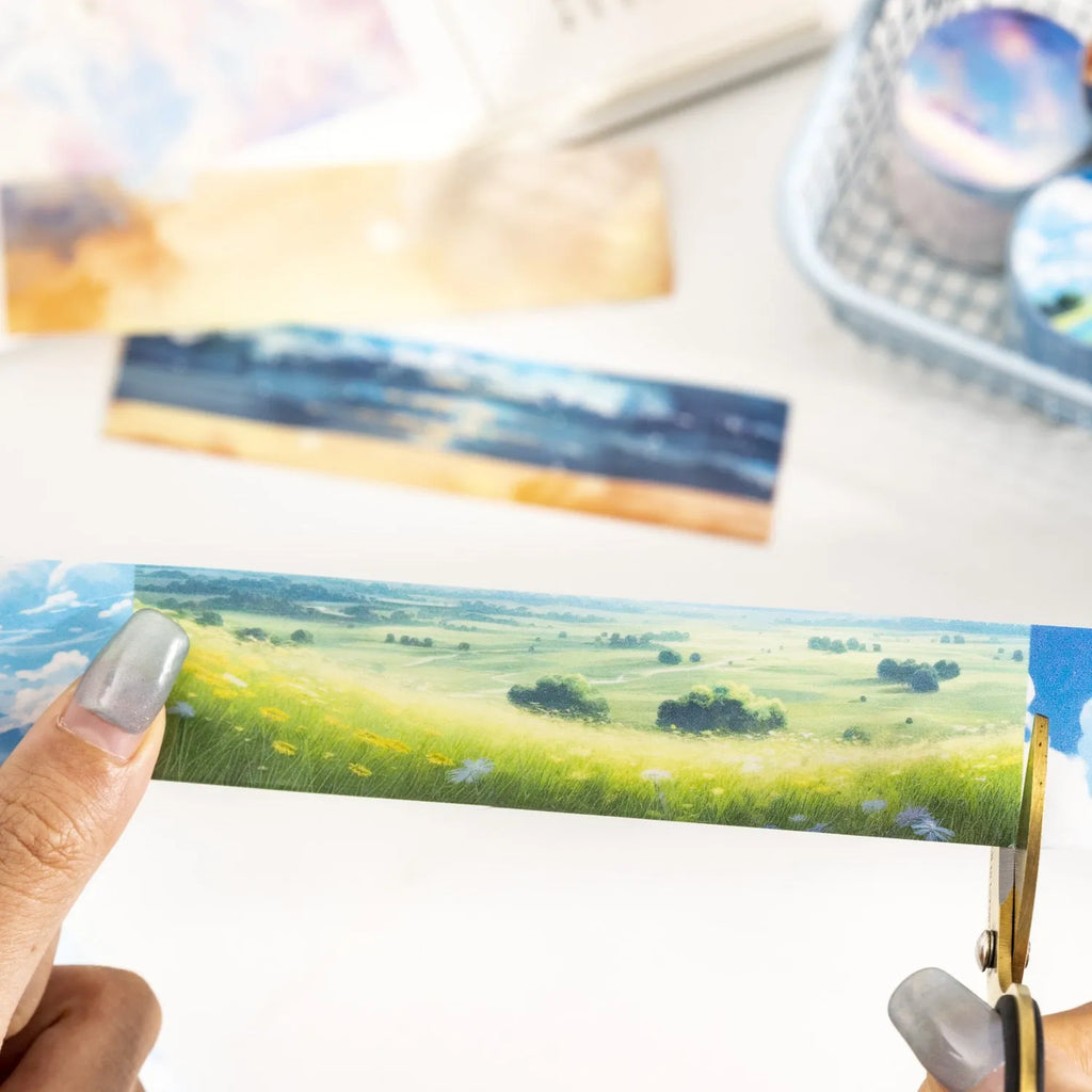 Japanese paper washi tape roll with cloud and sky theme designs including twilight and purple nebula patterns
