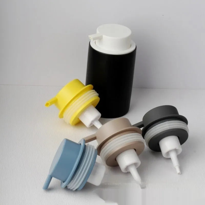 ABS plastic foam pump for facial cleanser in various metallic and matte colours.