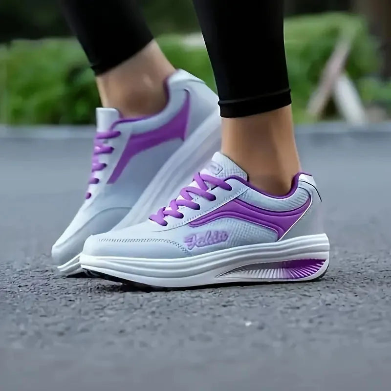 Women's heelless sports shoe in a selection of colours with a middle heel, shown with size scale.