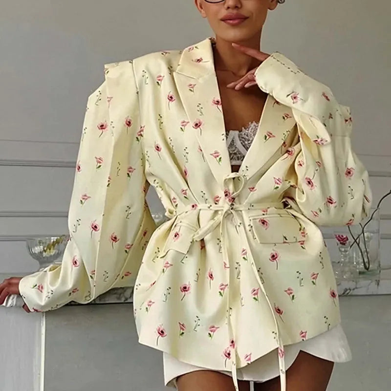 Women's floral print suit jacket with lace-up waist detail on collar, shown in apricot colour