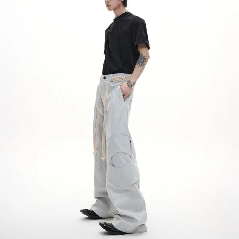 Men's dark blue loose-fit straight-leg cotton jeans with zip fly and pocket decoration.