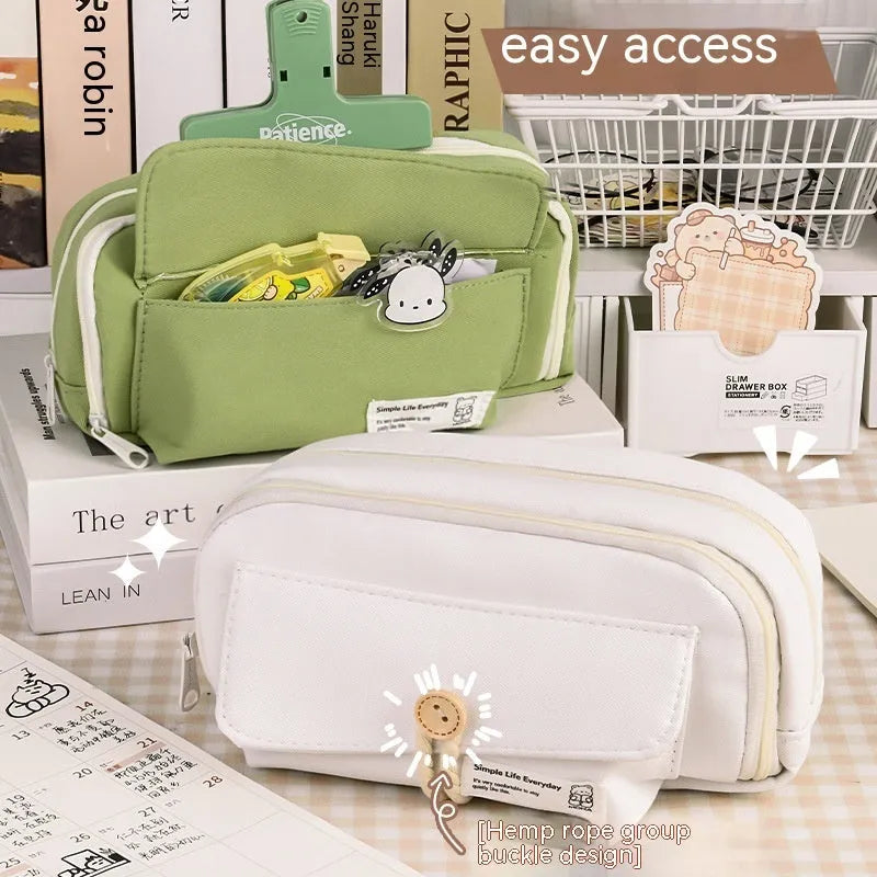 Korean style canvas pencil case in beige, blue, grey, or green holding multiple pens