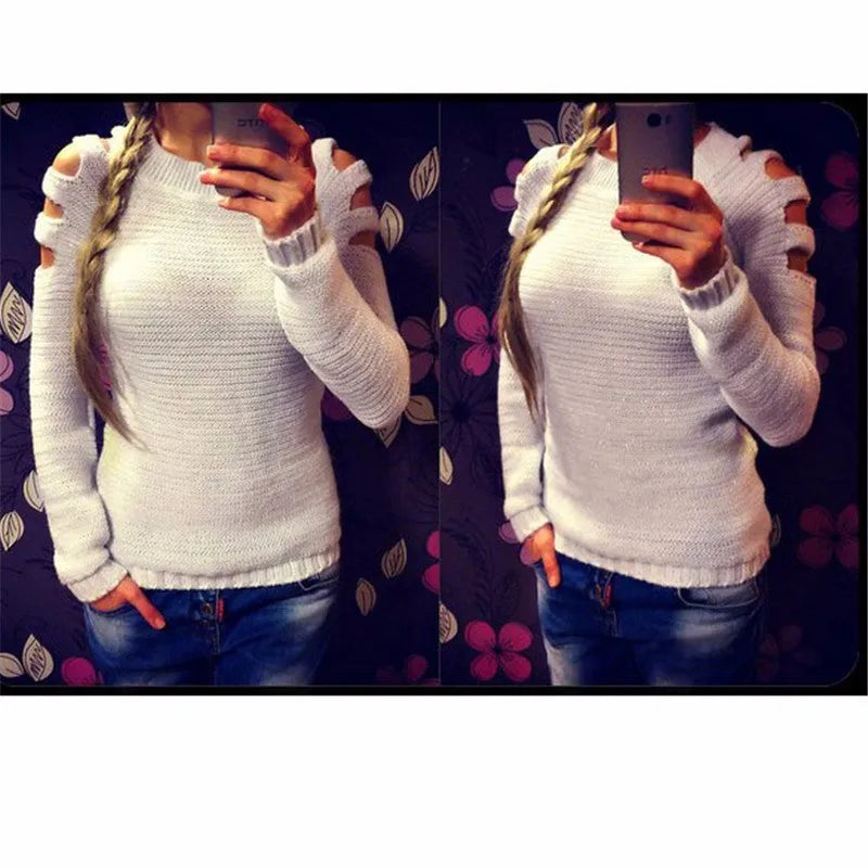 Women's white hollow-out crocheted knit long sleeve pullover shirt on a hanger.