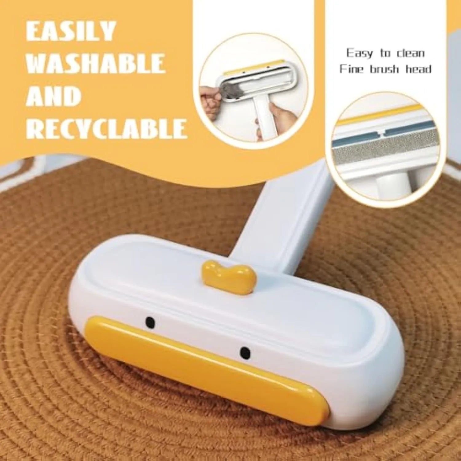 Yellow duck design portable manual pet hair remover tool on a fabric surface.