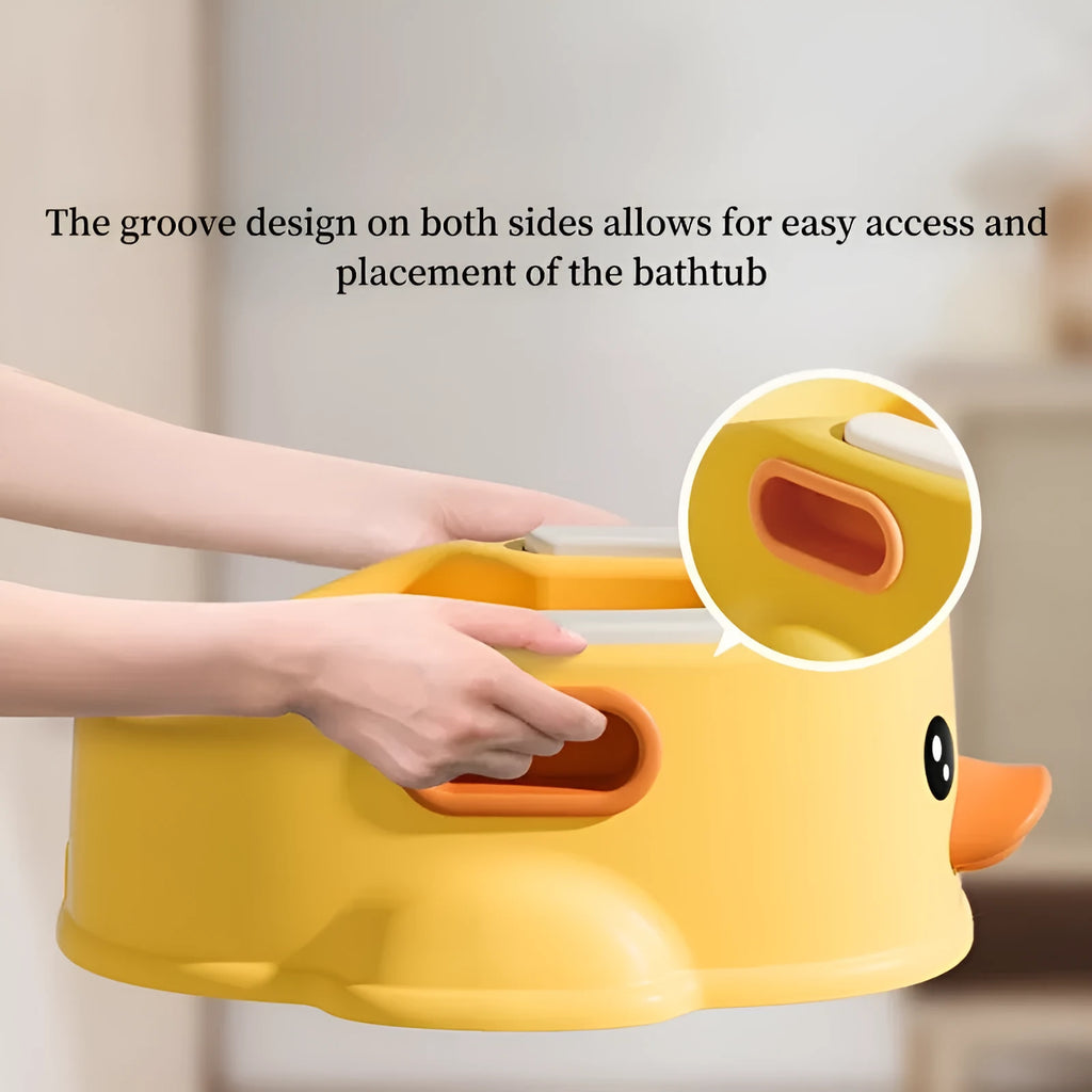 Blue PVC duck-shaped bathtub for washing dogs and cats on a lawn