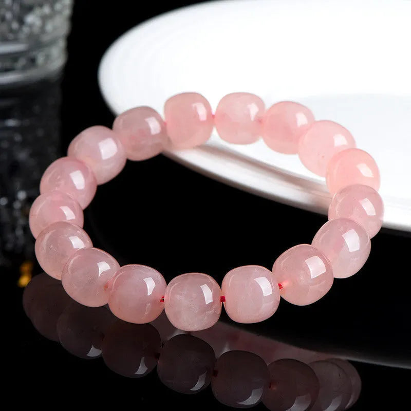 Pink natural crystal bracelet with barrel shaped beads in geometric design