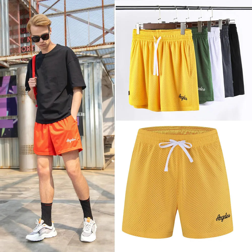 Men's black double-layer mesh sports shorts made from polyester fabric on a white background.