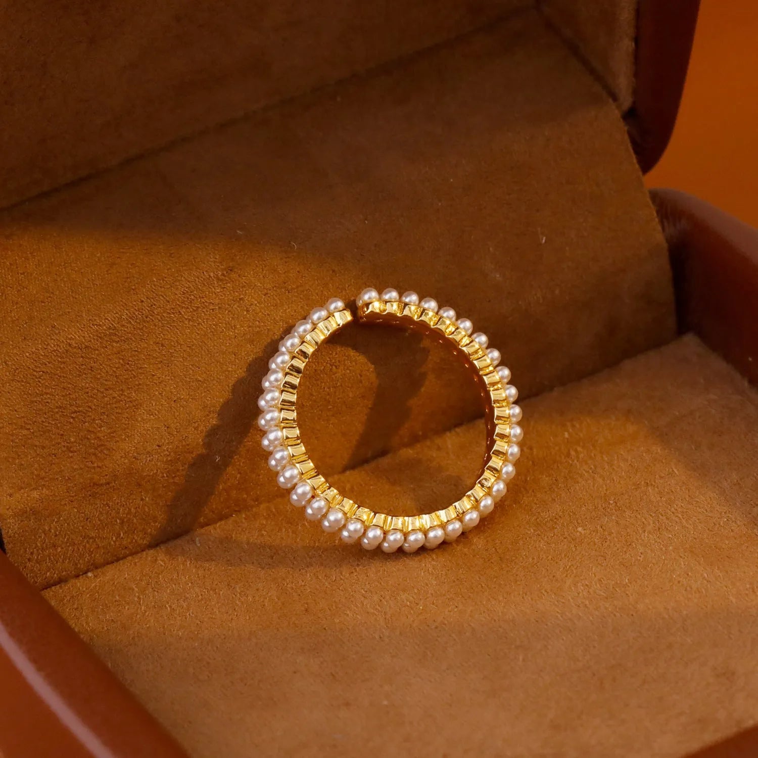 Gold geometric open mouth women's ring with pearl detailing on copper base