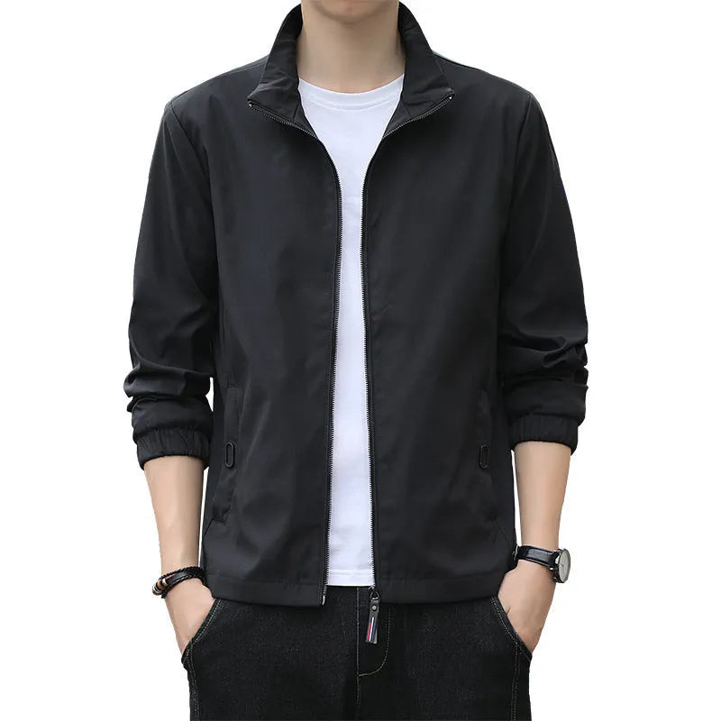 Man wearing a loose-fit Korean-style casual jacket in a dark colour, showing the lapel design, zip, and pockets.