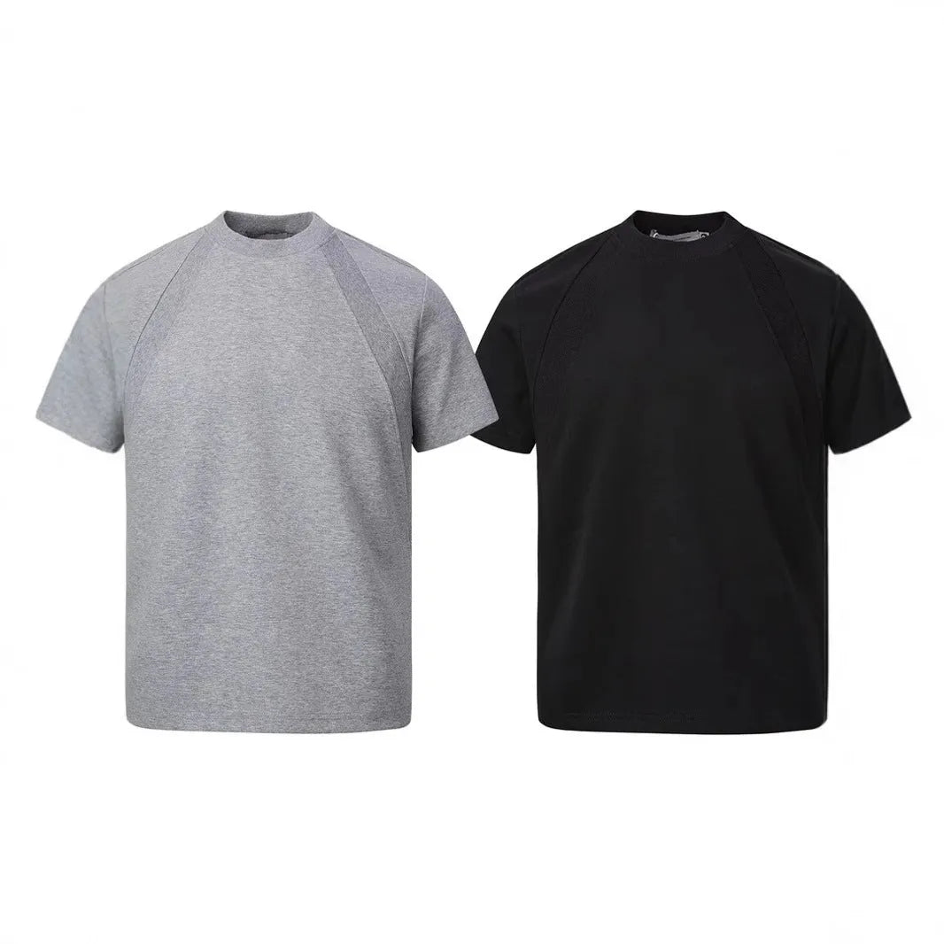 Man's loose grey short sleeve top with textured air layer stitching on the fabric