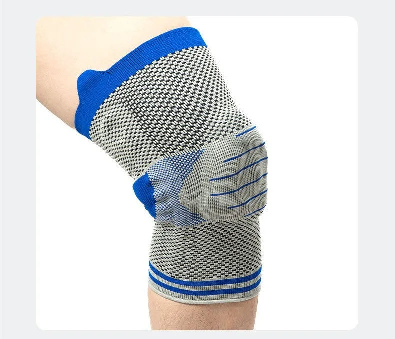 A cotton knee pad with a silicone shock absorber, shown in a grey and blue colour combination.