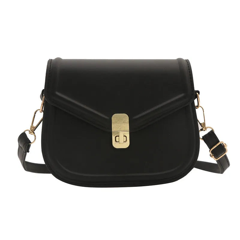 Soft PU leather messenger bag with clamshell opening shown in horizontal square shape on a shoulder strap.