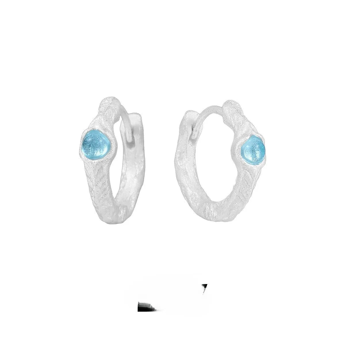 Burnt silver geometric circle ear clips for women made from 925 sterling silver.