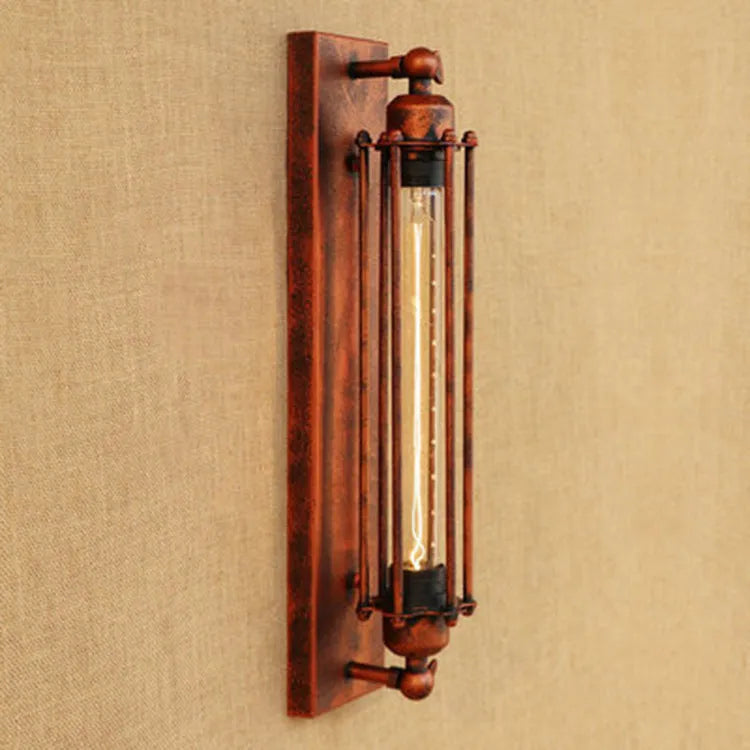 Industrial retro style iron flute wall lamp in antique finish, tall vertical design.