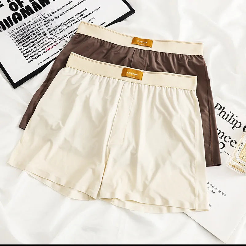Pack of three men's solid colour loose fit nylon ice silk underwear in mid-waist style.