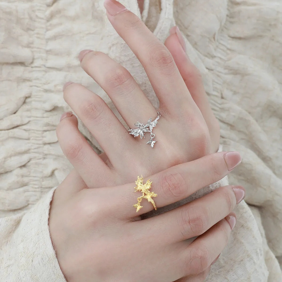Adjustable silver ring with a detailed wild butterfly design in a white gold or 18K gold colour finish.