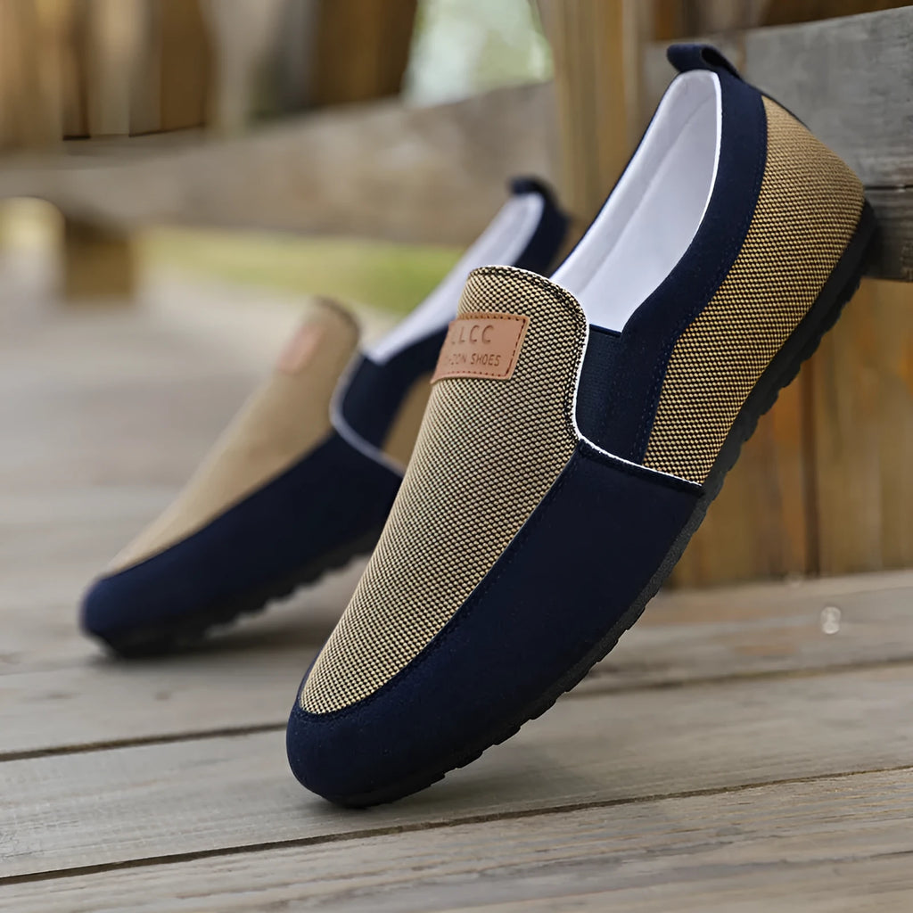 Men's grey canvas casual board shoes with round toe and rubber sole.