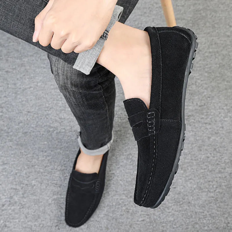 Men's solid colour suede loafers with round toe and slip-on design on rubber sole