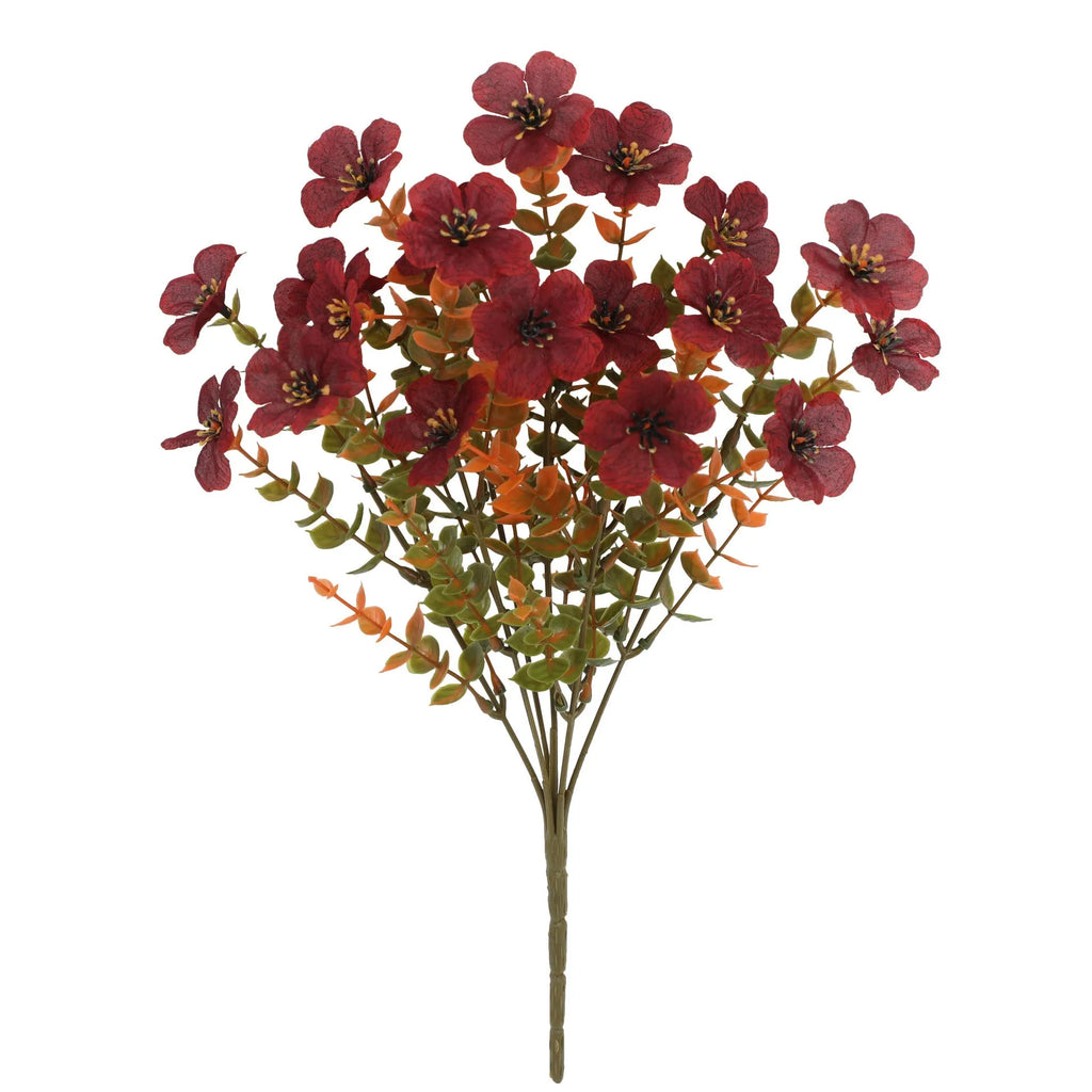 Artificial flower bouquet in autumn colours including orange, yellow, and red tones