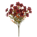 Artificial flower bouquet in autumn colours including orange, yellow, and red tones