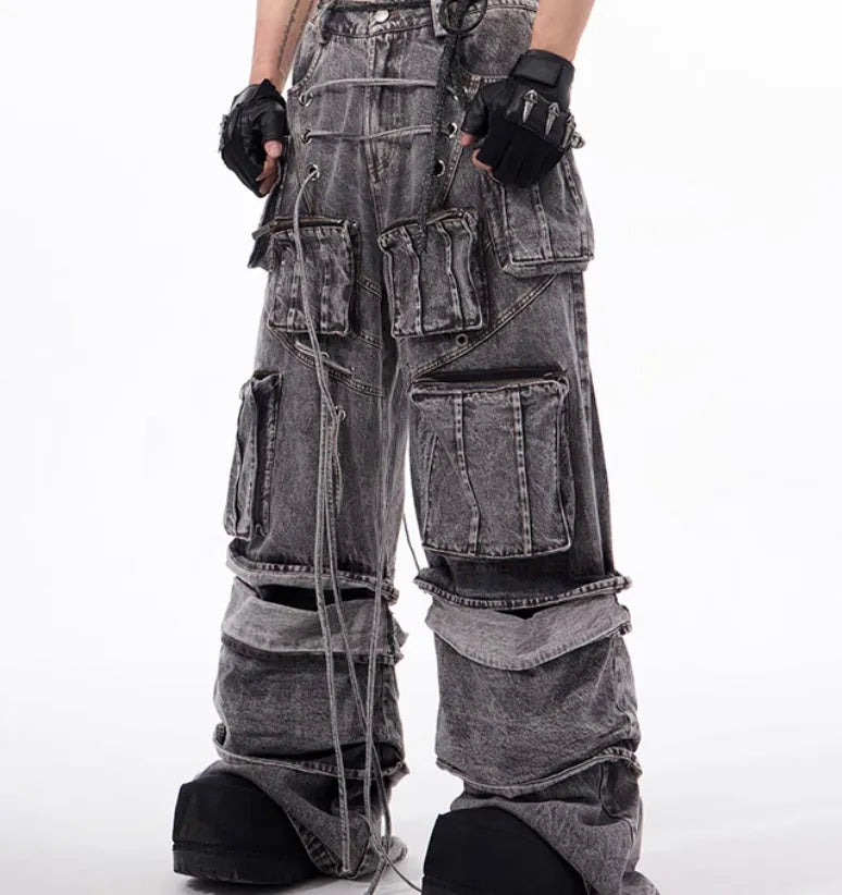 Grey cotton denim overalls with distressed finish and rope stitching on the legs.