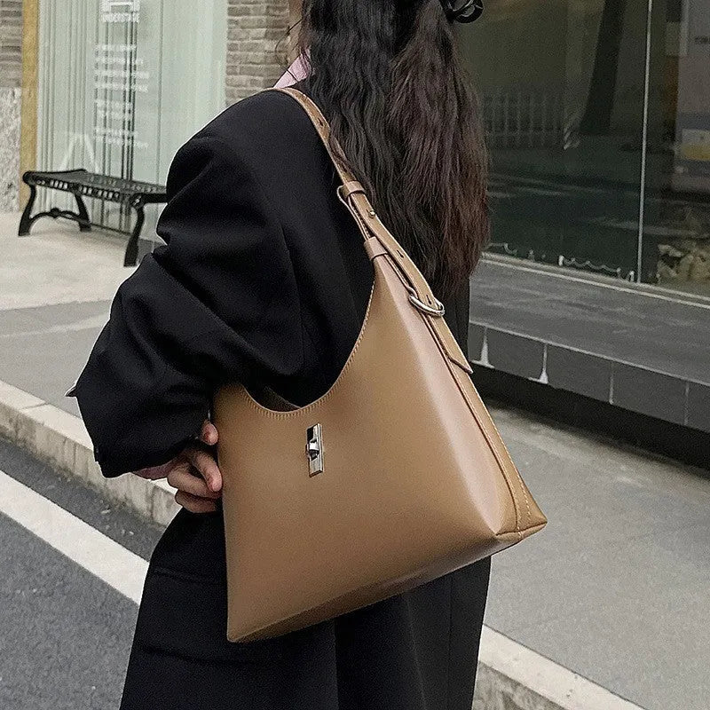 Genuine leather crossbody shoulder bag in dumpling shape with internal organiser compartments