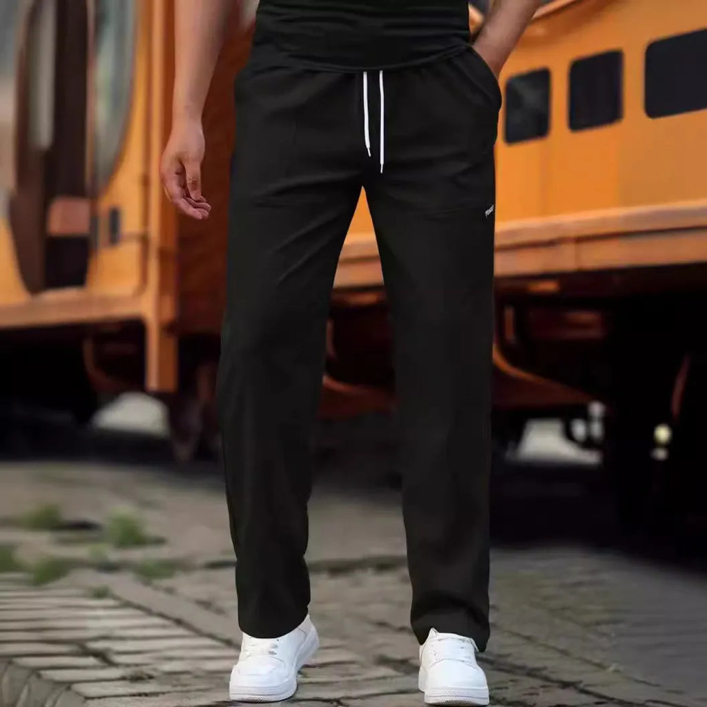 Men's slim fit polyester casual trousers in light gray colour on a hanger.