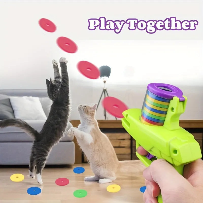 Battery-free interactive cat toy launcher firing foam disc with green and purple colour options