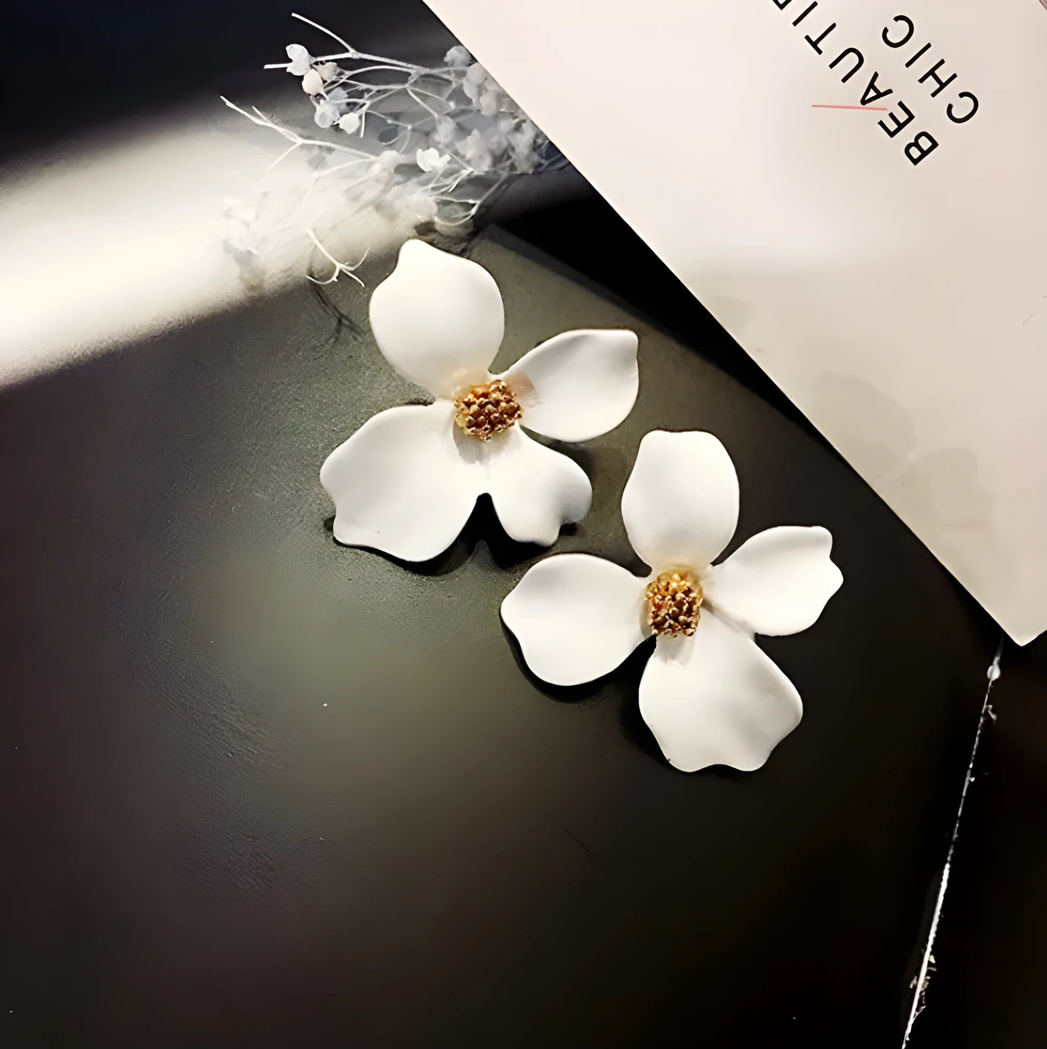Flower stud earrings for women in pink and white colour options with electroplated alloy construction