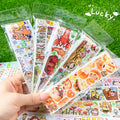 Sheet of cute cartoon character stickers on Japanese paper for haemorrhoid tape packaging.