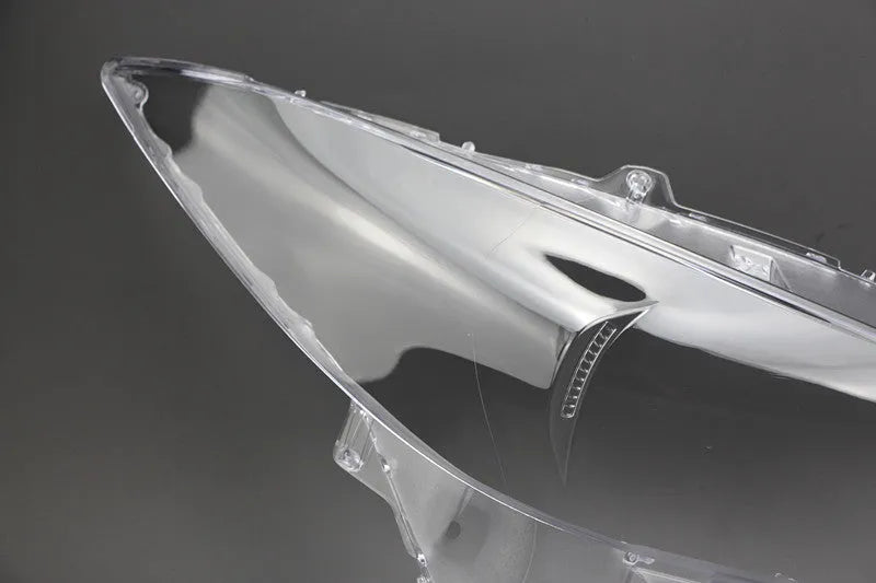 Mazda 3 Exela car headlamp cover replacement part with tube of snake glue adhesive.