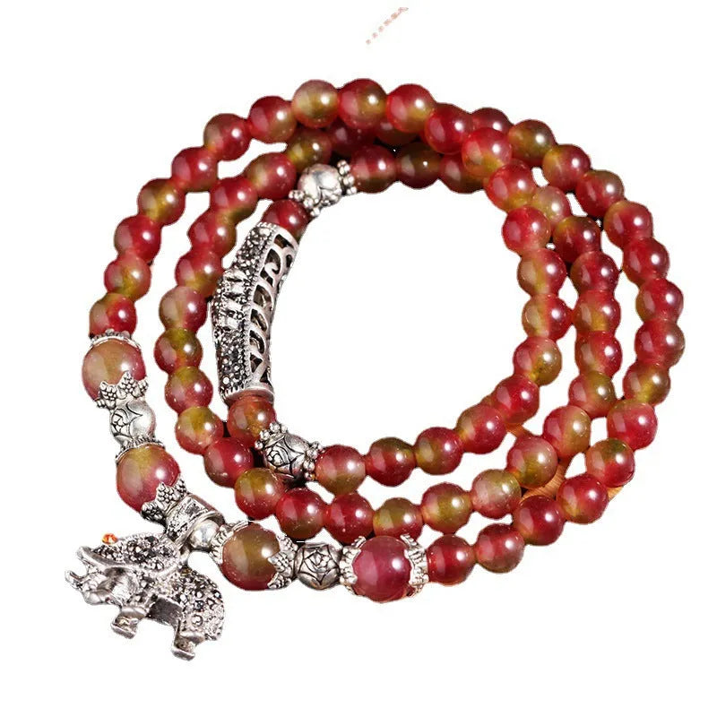 Handcrafted watermelon crystal bracelet with Chinese knot design in geometric shapes
