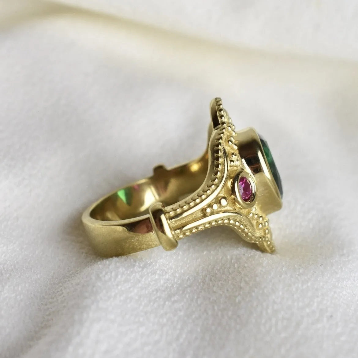 Women's geometric gold-plated ring with electroplated golden lvzuan finish shown from side view