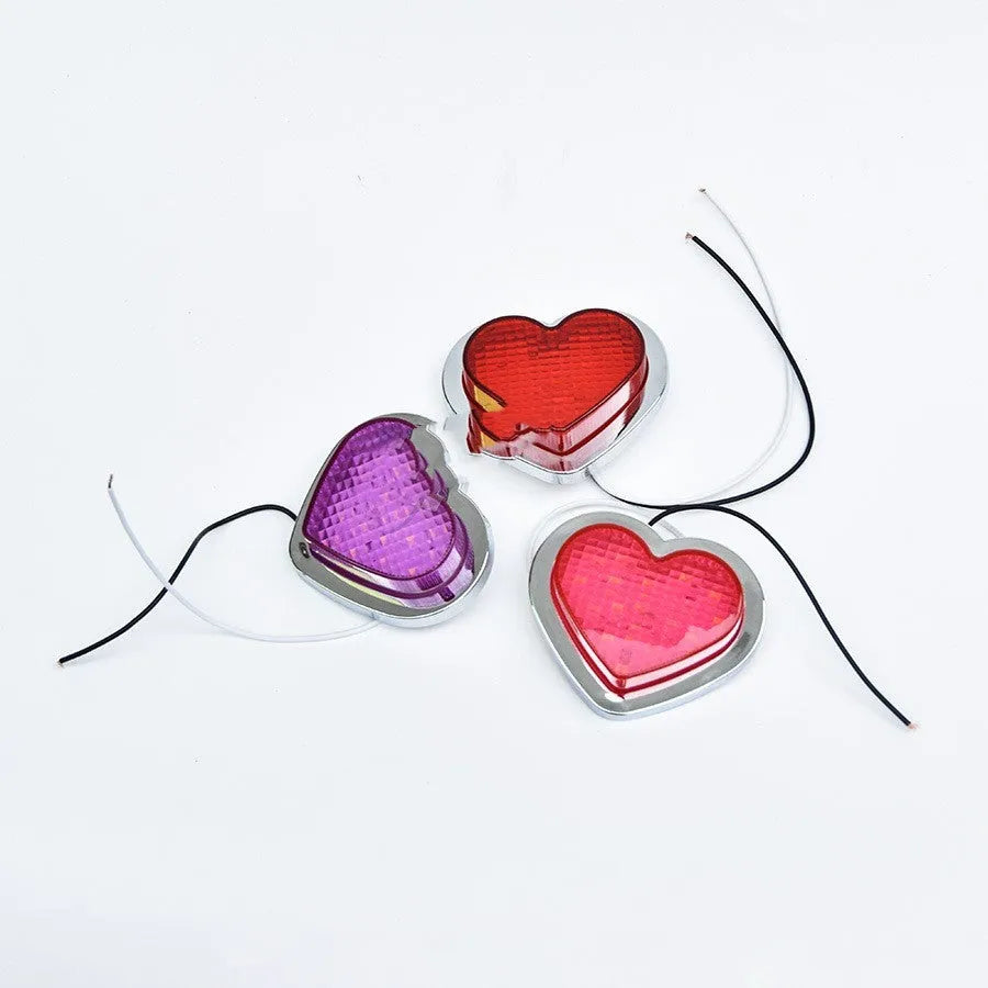 12V heart-shaped red LED automotive sidelight for fender mounting on a car.