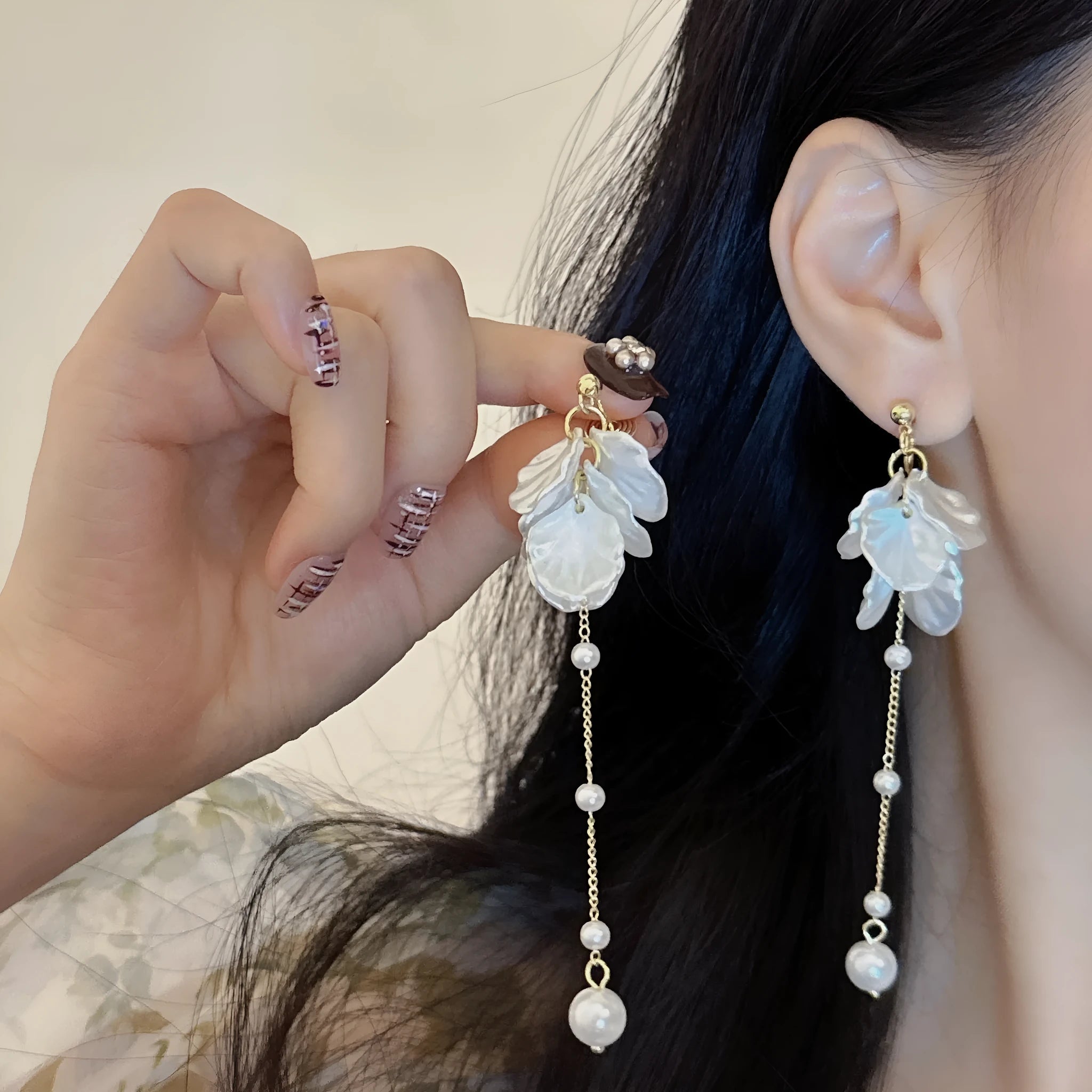 Women's acrylic shell pearl tassel earrings showing 8.8cm drop length and cushion ear clip option