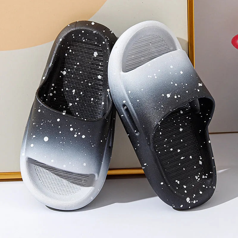Gradient coloured PVC slipper sandals for children on a white background.