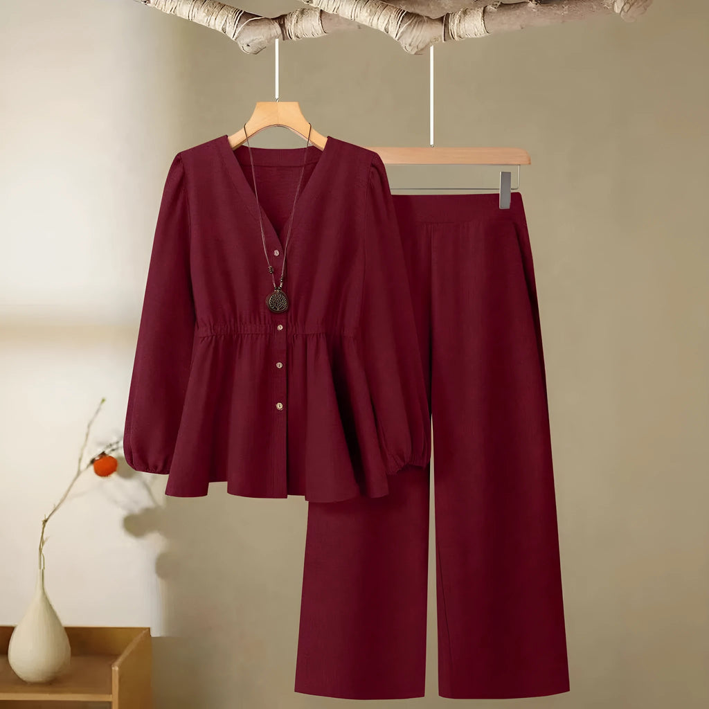 Women's long-sleeved two-piece polyester suit in khaki with button front top and matching trousers on model